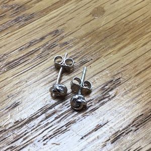 Tiny sterling silver love knot earrings.